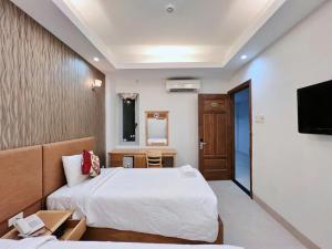 Postel nebo postele na pokoji v ubytování Sophia Sky Hotel