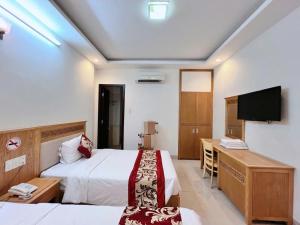 Postel nebo postele na pokoji v ubytování Sophia Sky Hotel