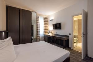 Postel nebo postele na pokoji v ubytování Hotel Ovest