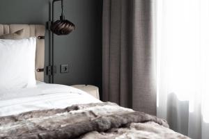 Letto o letti in una camera di Elite Hotel Frost - Hotel & Spa