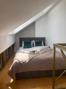 a bedroom with a large bed with a bowl on it at NICE Apartament Głogów in Głogów +38 photos