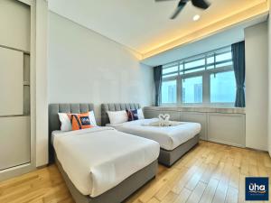 Pine Tree Suites by RR JBcity客房内的一张或多张床位