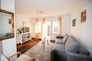 a living room with a couch and a table at Angelica Apartment in Vilnius