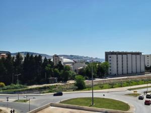 an empty street in a city with a road at Apartments 402 in Bar