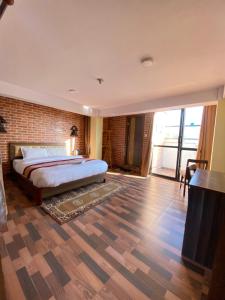 Postel nebo postele na pokoji v ubytování Hotel Durbar Side
