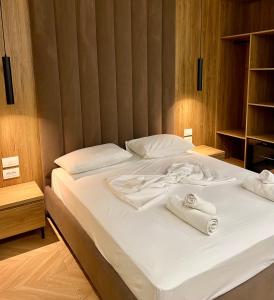 Postel nebo postele na pokoji v ubytování Karos Hotel Llaman