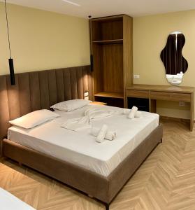 Postel nebo postele na pokoji v ubytování Karos Hotel Llaman