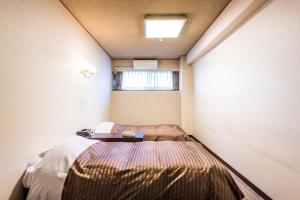 Postel nebo postele na pokoji v ubytování Ooedo Onsen Monogatari Premium Kinugawa Kanko Hotel
