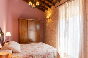 Postel nebo postele na pokoji v ubytování Apartamentos rurales La Alquería del Pilar