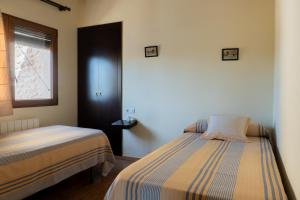 Postel nebo postele na pokoji v ubytování Apartamentos rurales La Alquería del Pilar