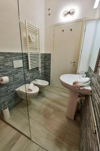 a bathroom with a sink and a toilet and a mirror at VILLA IRMA in Varigotti