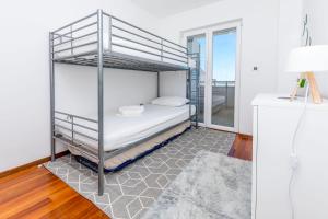 Postel nebo postele na pokoji v ubytování Apartment Belle Vue