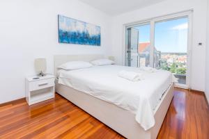 Postel nebo postele na pokoji v ubytování Apartment Belle Vue