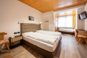 Postel nebo postele na pokoji v ubytování Hotel Oswald