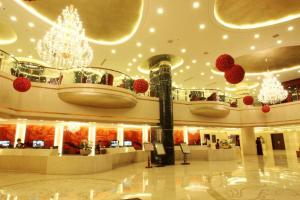 a lobby with chandaliers and red hearts on the ceilings at OSOTTO RECREATION HOTEL in Foshan +78 photos