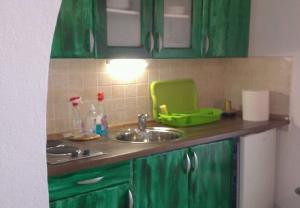 Kuchyňa alebo kuchynka v ubytovaní Apartments Neno