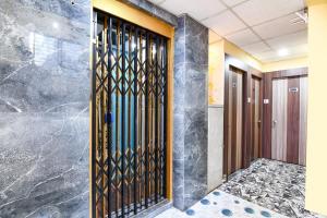 Postel nebo postele na pokoji v ubytování FabHotel JBL - Near Kolkata Airport