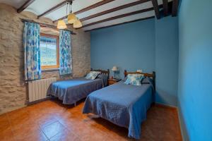 Postel nebo postele na pokoji v ubytování Apartamentos rurales La Alquería del Pilar