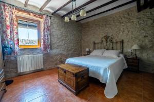 Postel nebo postele na pokoji v ubytování Apartamentos rurales La Alquería del Pilar