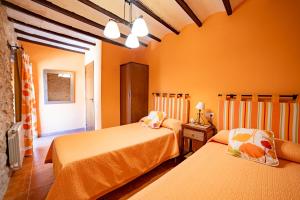 Postel nebo postele na pokoji v ubytování Apartamentos rurales La Alquería del Pilar