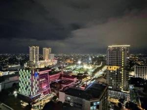 a view of a city at night with lights at Apartemen delipark tower lexington in Medan