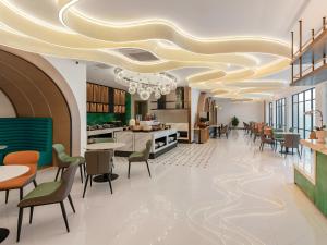 a rendering of a restaurant with a spiral ceiling at Magnotel Guilin Elephant Trunk Hill in Guilin