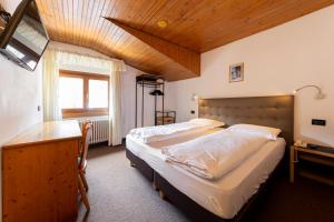 Postel nebo postele na pokoji v ubytování Hotel Oswald