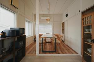 a kitchen and dining room with a table and chairs at 塩釜バケーションレンタル Sora No Oka in Shiogama +49 photos