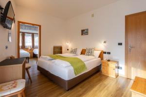 Postel nebo postele na pokoji v ubytování Hotel Oswald