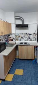 a kitchen with a sink and a counter top at Olimp SeaSun in Olimp