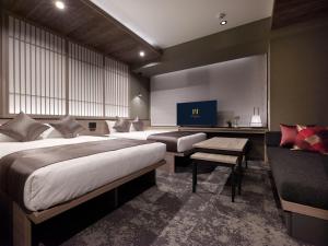 Postel nebo postele na pokoji v ubytování GRAND MONday GINZA