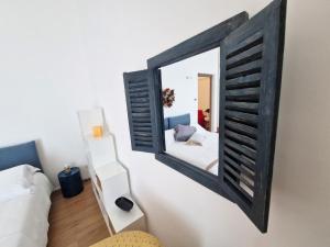 A bed or beds in a room at Palazzo Pinto B&B