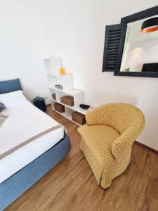 A bed or beds in a room at Palazzo Pinto B&B