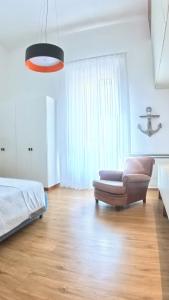 A bed or beds in a room at Palazzo Pinto B&B