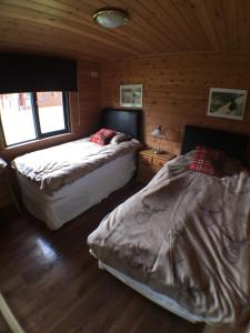 Postel nebo postele na pokoji v ubytování Lochlomondlodge22