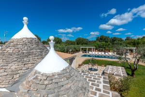 a view from the roof of a house with a swimming pool at Trulli di Buontempo in Francavilla Fontana