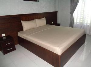 Voodi või voodid majutusasutuse Wisma Mutiara Syariah Langsa toas
