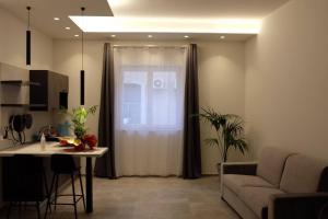 TV a/nebo společenská místnost v ubytování Borgo di Levante luxury apartments