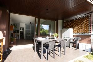 a kitchen and dining room with a table and chairs at La Selva Lake by Lago Maggiore Rentals in Ghiffa