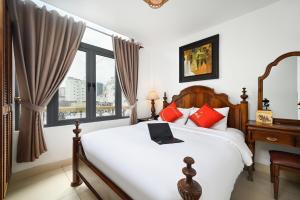 Ένα ή περισσότερα κρεβάτια σε δωμάτιο στο Halo Boutique Ben Thanh Hotel