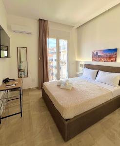 Postel nebo postele na pokoji v ubytování Isgró B&B + 8 fotografií