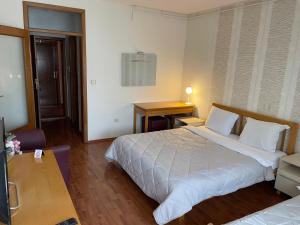 Postel nebo postele na pokoji v ubytování Hotel Belvedere Casa