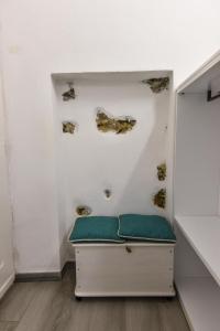 a room with a bench and fossils on the wall at VILLA IRMA in Varigotti