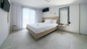 Katil atau katil-katil dalam bilik di Christina Sunshine Apartments
