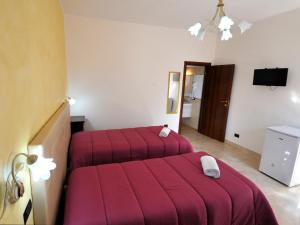 Postel nebo postele na pokoji v ubytování Il Calesse B&B