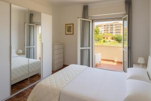 A bed or beds in a room at Casa Stazione Magliana