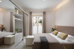 a bedroom with a bed and a large window at Luxury 4 star apartment in the Old Town Zadar in Zadar