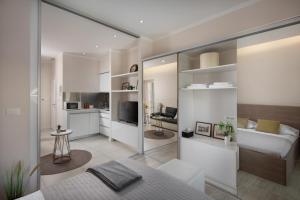 a bedroom with a bed and a living room at Luxury 4 star apartment in the Old Town Zadar in Zadar