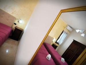 Postel nebo postele na pokoji v ubytování Il Calesse B&B