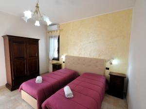 Postel nebo postele na pokoji v ubytování Il Calesse B&B